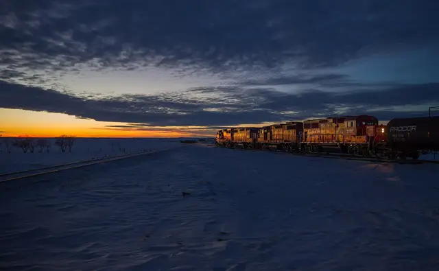 CP locomotives and tank cars at dusk